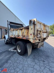 Dump truck bed with rust and wear showing rear view of dump body on International 4800 truck.