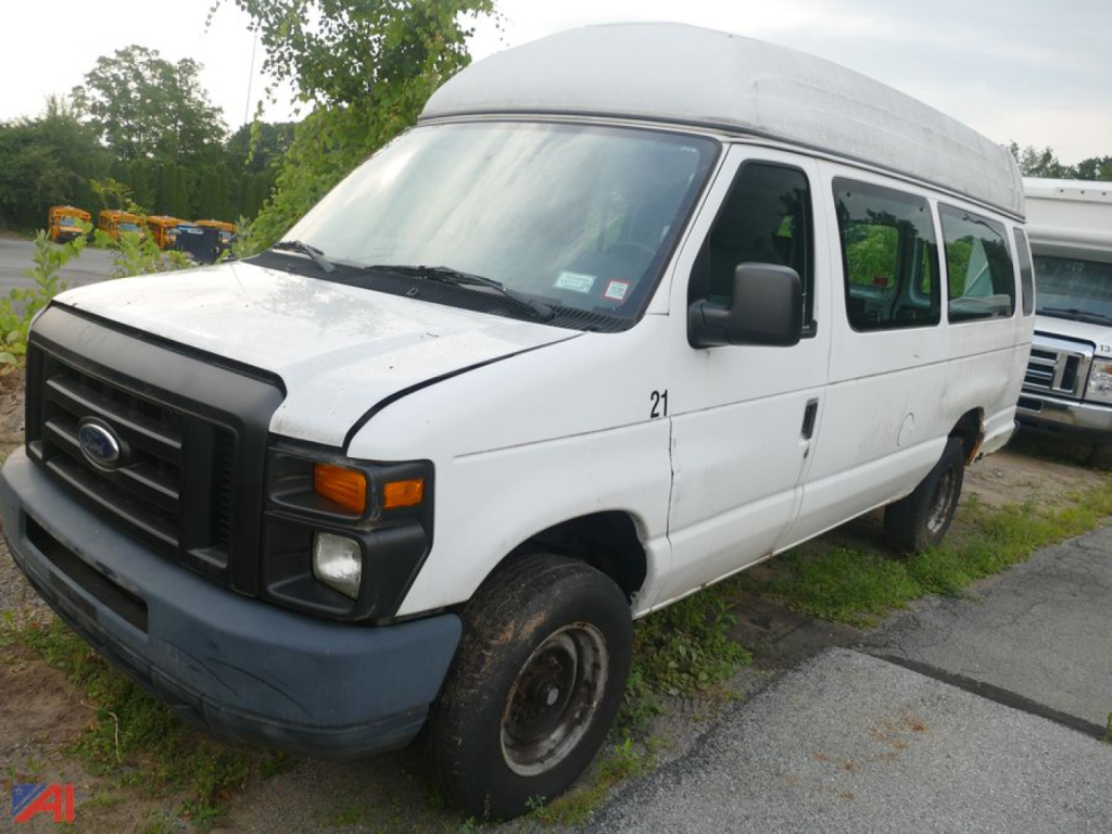 Ford E-350 Super Duty cargo van with wheelchair lift, white, angled front-left view