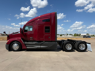 Kenworth T680 cab and chassis in side view showing sleeper cab, red paint, dual rear drive axles, chrome wheels, and aerodynamic design.