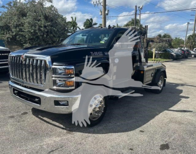 2019 International CV truck with winch, front grille chrome, dark blue cab, flatbed, used condition.