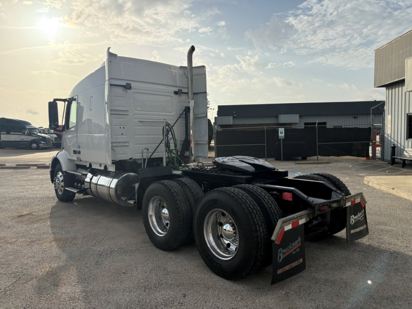 Truck chassis and cab of a 2019 Volvo VNR64T640 tractor viewed from rear-left showing dual rear axles, fuel tanks, and sleeper cab.