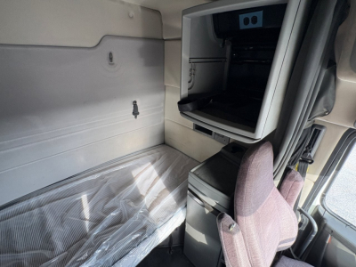  Volvo truck cab interior sleeper area showing bunk space and storage cabinet