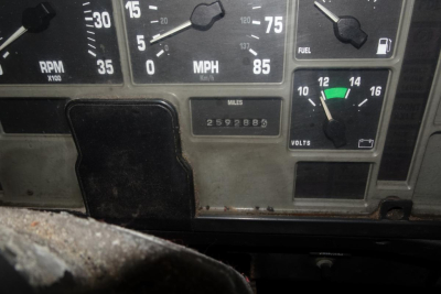 Instrument cluster of a 2002 International 4700 showing speedometer up to 85 mph, odometer reading 259,288 miles, fuel gauge, volt meter, and RPM gauge.