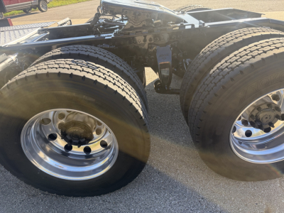 Freightliner Cascadia 126 tractor dual rear axles with dual wheels, chassis frame and fifth wheel area visible