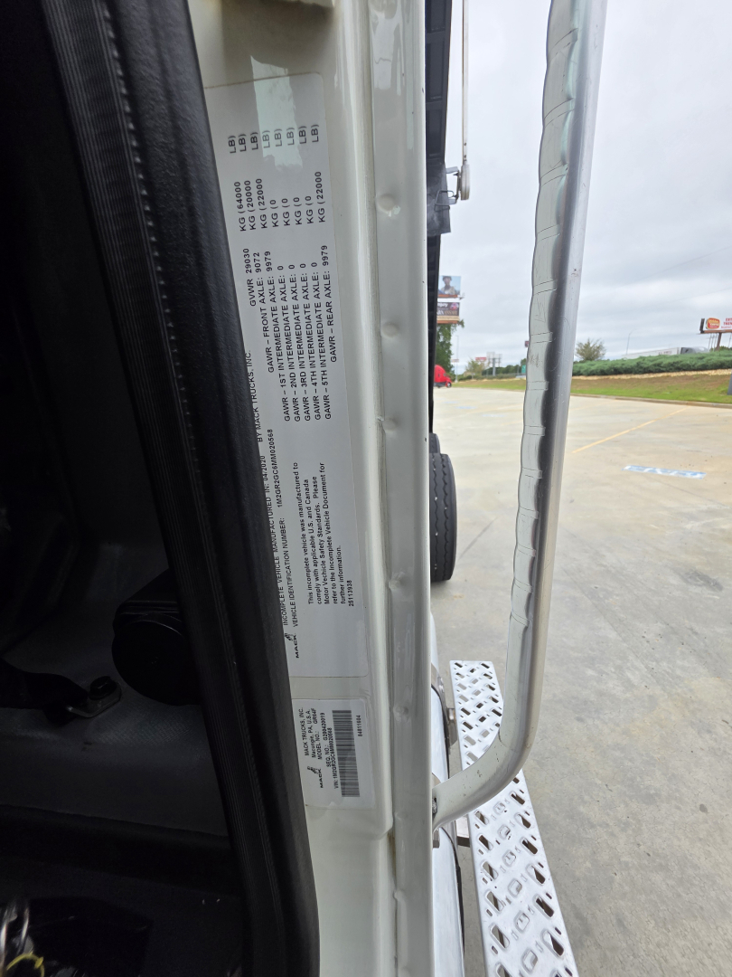 Mack Granite truck door jamb label showing VIN and specifications, vertical orientation with data plate visible.