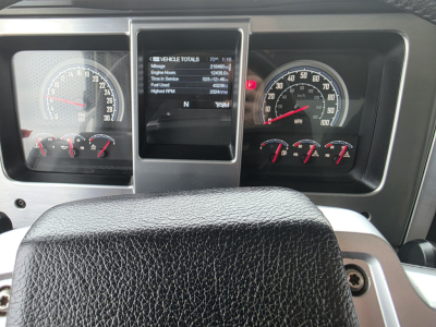 Dashboard of a Mack Granite truck showing instrument cluster, center display, and gauges.