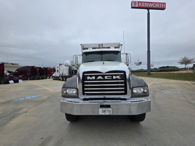 Mack Granite dump truck front view showing bold grille with MAC K letters and chrome bumper.