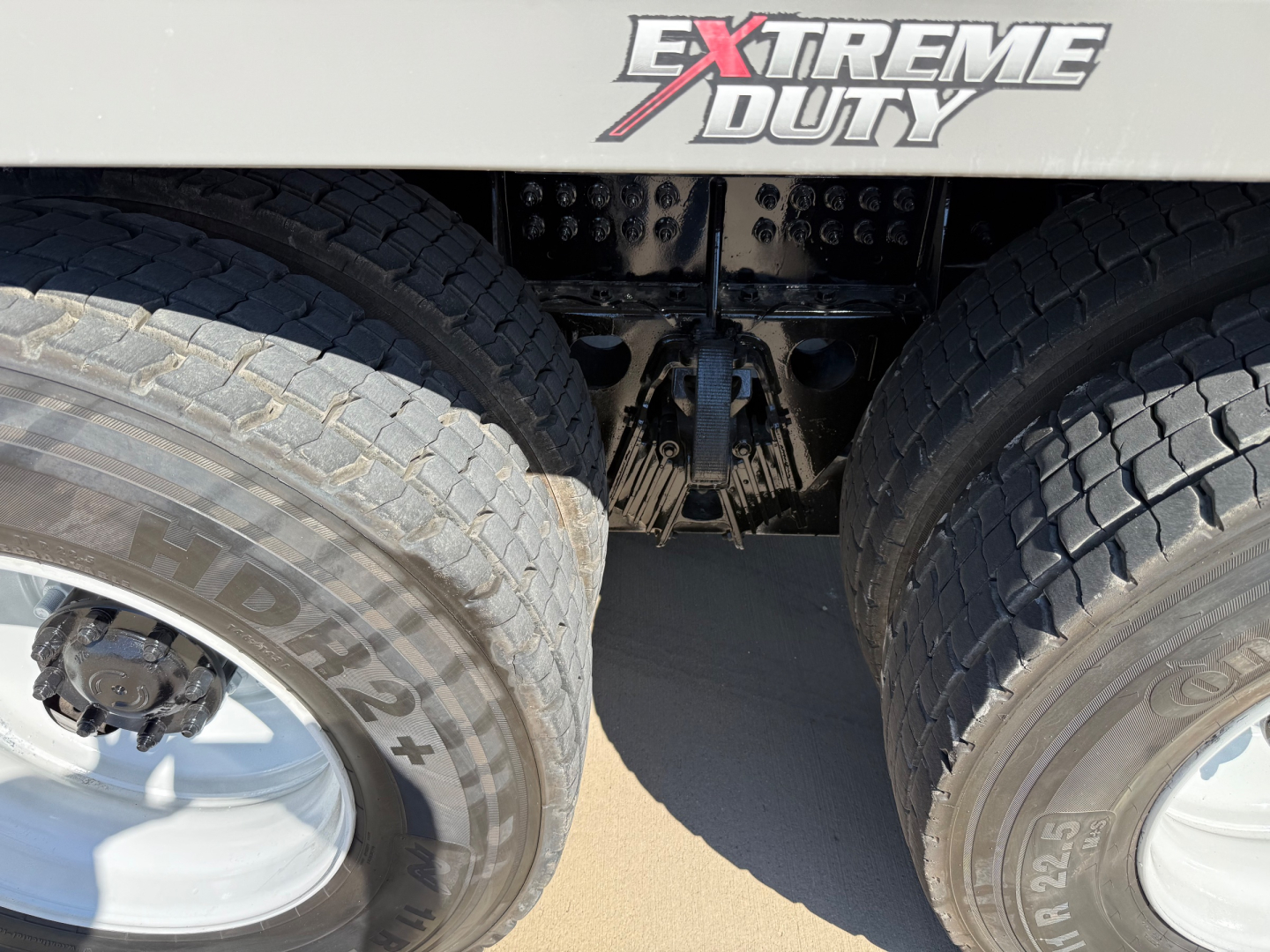 Kenworth T880 mixer truck rear view showing dual rear tires and chassis area with Extreme Duty branding on the body.