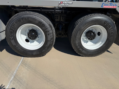 Kenworth T880 mixer truck dual rear wheels with Continental tires and white rims, side decals show Extreme Duty and On-Tech Manufacturing logos.