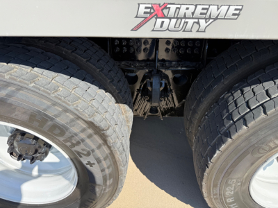 Kenworth T880 mixer truck rear view showing dual rear tires and chassis area with Extreme Duty branding on the body.