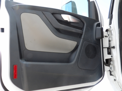 Volvo VNL64T300 door interior showing panel and speaker grill
