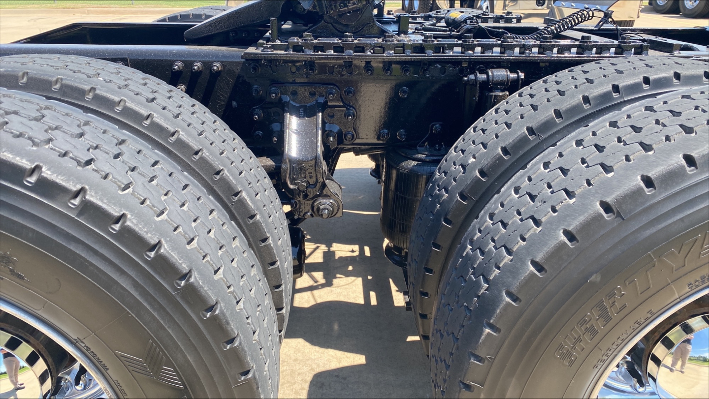 Mack AN64T70 tandem axle tractor chassis view showing dual rear axles and frame rails