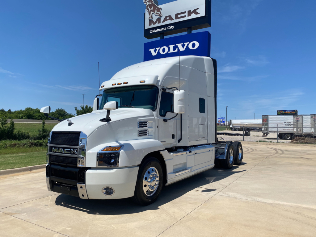 2019 Mack AN64T70 tractor unit in a dealership lot showing front and side view with sleeper cab.