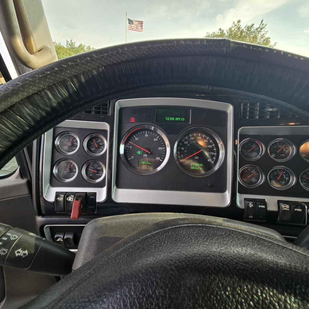 Kenworth T800 dashboard view showing gauge cluster and steering wheel with digital readout