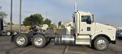 Kenworth T800 conventional daycab tractor showing chassis and cab with dual rear axles and fuel tanks. No text legible on labels visible.