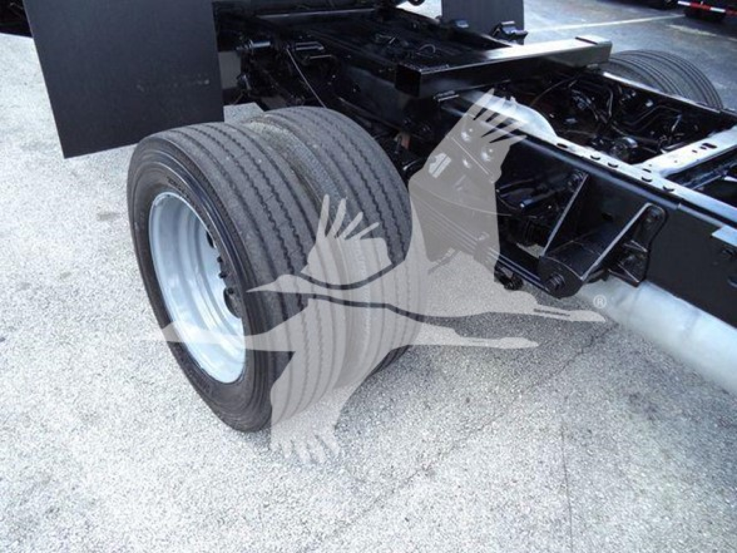 Ford F-550 chassis showing rear dual rear wheel and frame with no cargo bed; visible components include wheel, suspension, and chassis frame.