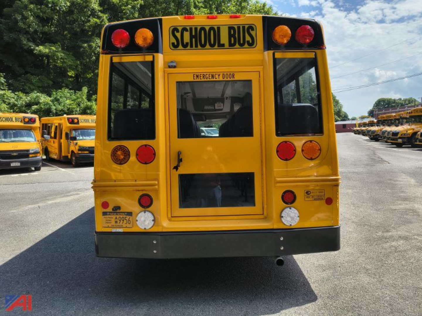 Rear view of a yellow school bus with 