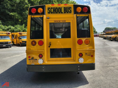Rear view of a yellow school bus with 