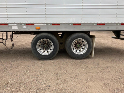 Trailer dual rear wheels of a 2012 utility reefer showing aluminum sidewall and tires.