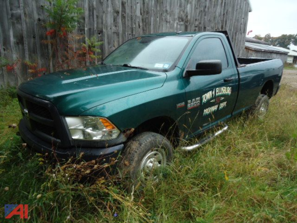 Ram 2500 pickup with green body and extended cab showing side decals and running boards.