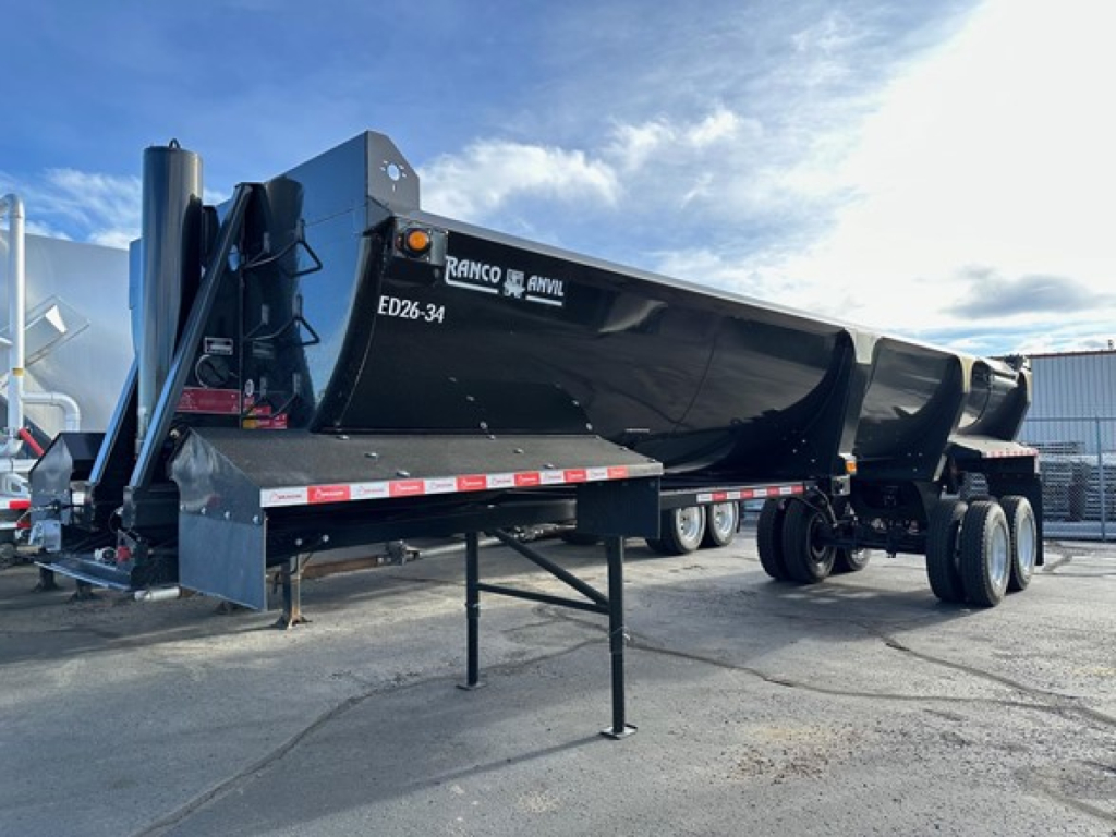 Ranco ED26-34 dump trailer in black with white lettering, side view, appears new, with landing gear extended and dual rear axles.