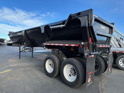 Dump trailer showing Ranco ED26-34 model with black dump body and dual rear axles, white wheels, and support legs in a parking lot.