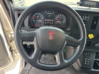 Kenworth T380 steering wheel and dashboard with gauges and controls visible inside cab