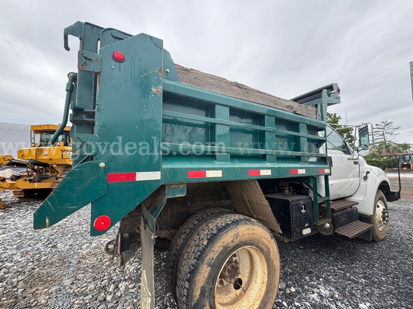 Ford F-750 dump truck side view showing bed and tires