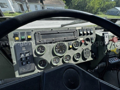 Stewart & Stevenson M1083A dashboard showing multiple gauges and switches from the cab interior.