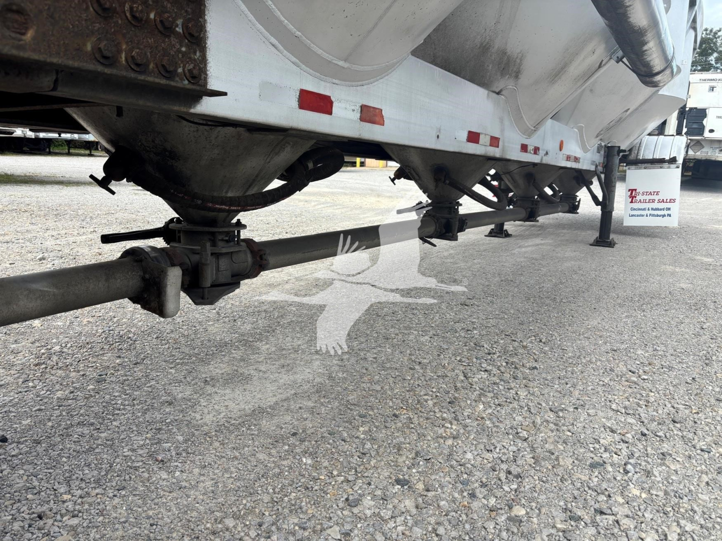 Trailer undercarriage view showing air ride suspension and underside of polars 1660 pneumatic-dry bulk trailer.