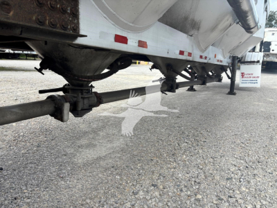 Trailer undercarriage view showing air ride suspension and underside of polars 1660 pneumatic-dry bulk trailer.