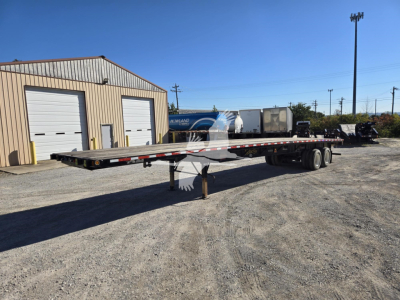 2017 Fontaine steel flatbed trailer in industrial lot, flatbed with dual rear axles, VIN plate not clearly visible, stock number 7844, long flatbed with supporting stands.
