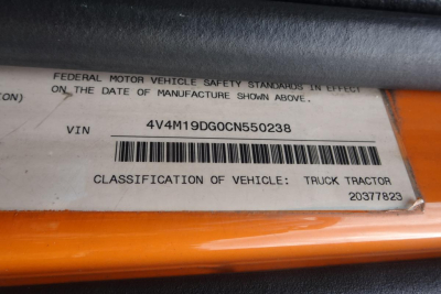 VIN label on vehicle shows 4V4M19DG0CN550238 with barcode; Federal Motor Vehicle Safety Standards text; classification says TRUCK TRACTOR.