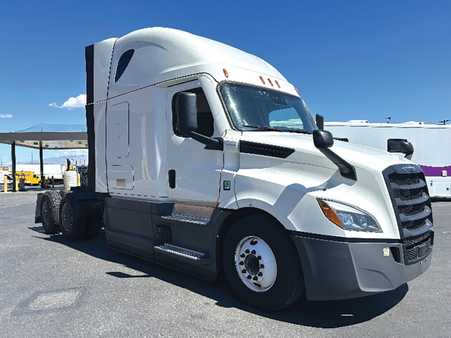 Freightliner Cascadia126 semi-truck cab showing side view with sleeper and wheel, no visible text.