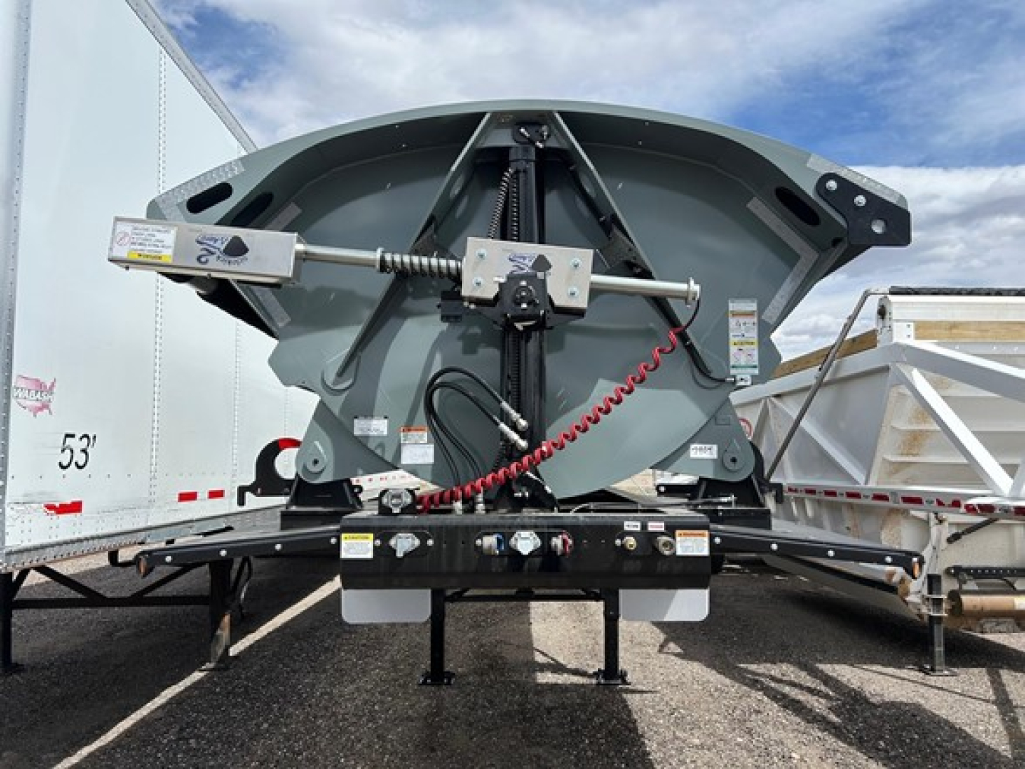 Front view of 2026 Smithco Air Ride Side Dump trailer showing hydraulic lift mechanism and rear support frame.