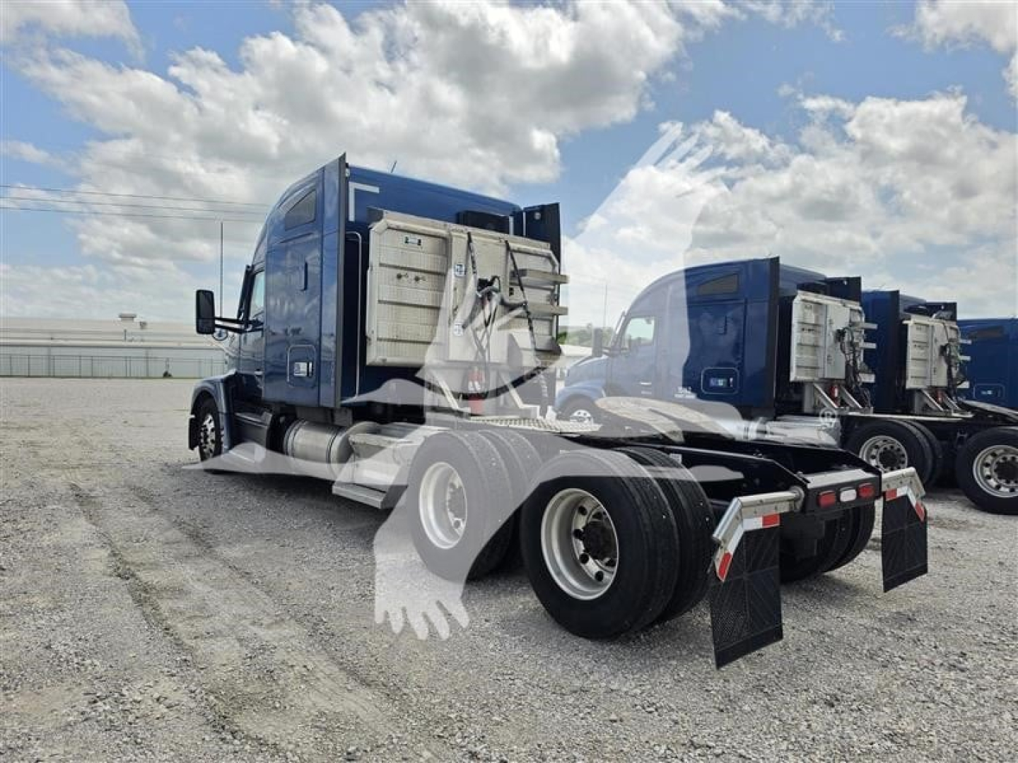 Kenworth T680 tractor rear and side view showing sleeper cab, dual rear axles, and chassis with fuel tanks; blue exterior; back view with mudflaps.
