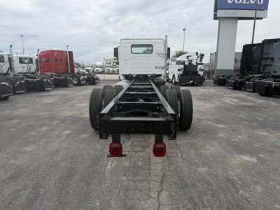 Rear view of a Volvo VHD86B300 cab and chassis showing dual rear axles, chassis frame, and rear lights.