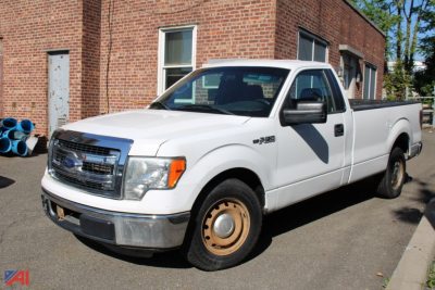 Ford F-150 pickup truck 2014 2WD white with long bed, front grille, single cab, plain steel wheels, in-service condition.