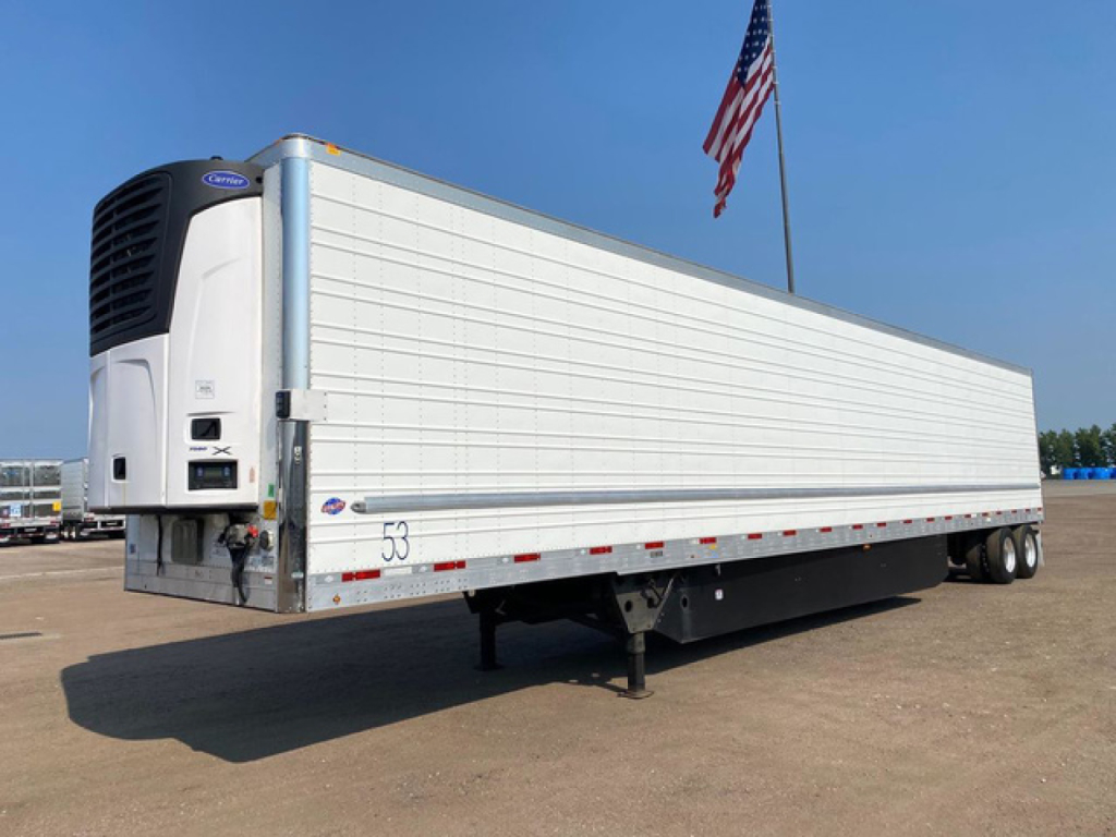 Utility refrigerated trailer with white side walls and a vertical trailer refrigeration unit at the front showing stock number 53 and a small brands label.