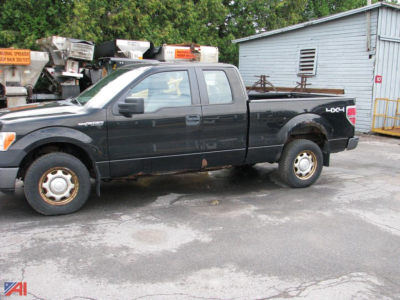 2004-2019 Ford F-150 pickup extended cab 4x4 side view showing black body, extended cab, '4x4' badge on rear quarter, steel wheels, used pickup truck.