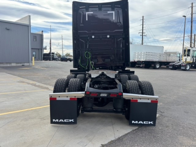 Mack PR64T76H tractor rear view showing fifth wheel, dual rear tires, and mud flaps with Mack branding.