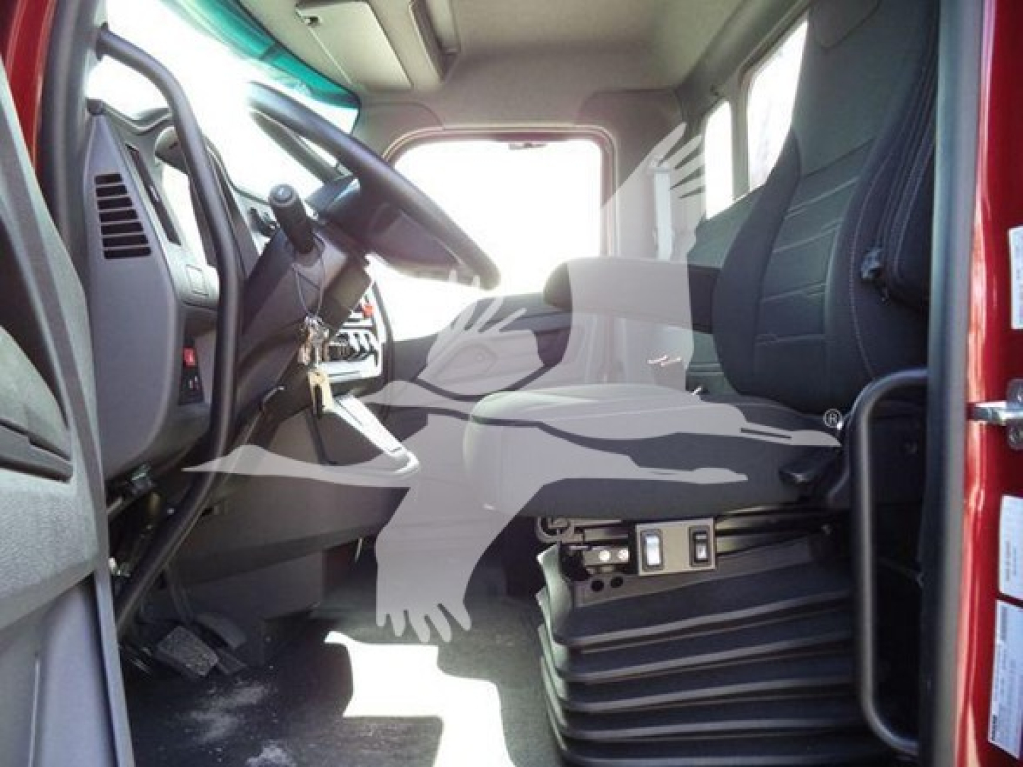 Kenworth T280 truck cab interior view showing steering wheel, driver seat, dashboard controls, and entry area with pedals visible.