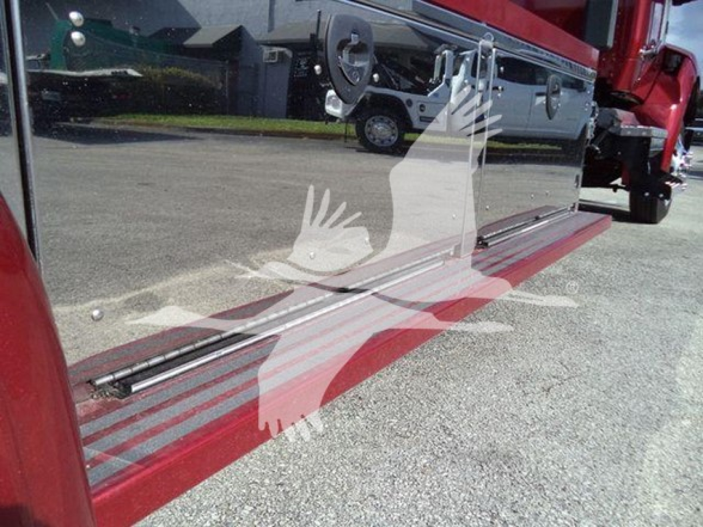 Kenworth T280 rollback truck side view showing reflective door with chrome step and red lower panel.