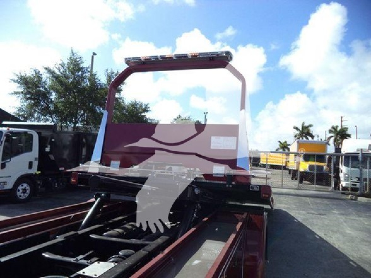Kenworth T280 rollback truck cab rear view showing lifting frame and rear chassis with components visible.
