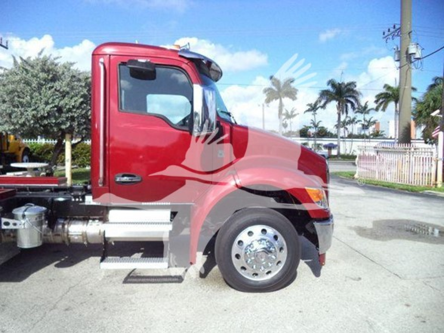 Kenworth T280 rollout truck side view showing cab, front wheel, and part of chassis with fuel/air lines.