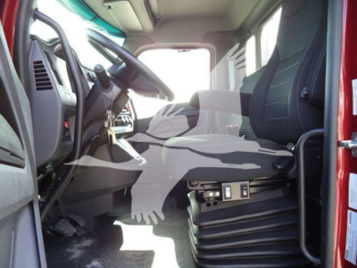 Kenworth T280 truck cab interior view showing steering wheel, driver seat, dashboard controls, and entry area with pedals visible.
