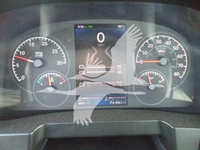 Dashboard of a 2025 Kenworth T280 showing digital speedometer at 0 MPH, analog gauges for RPM and speed, with VIN and stock number notations, and center touchscreen display.