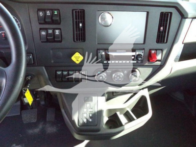 Kenworth T280 dashboard view showing center control panel and cup holder area.