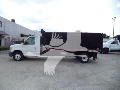 Ford E-450 dump truck side view showing cargo box and cab with white color, stock number T83803 and VIN 1FDXE4FS1BDA83803