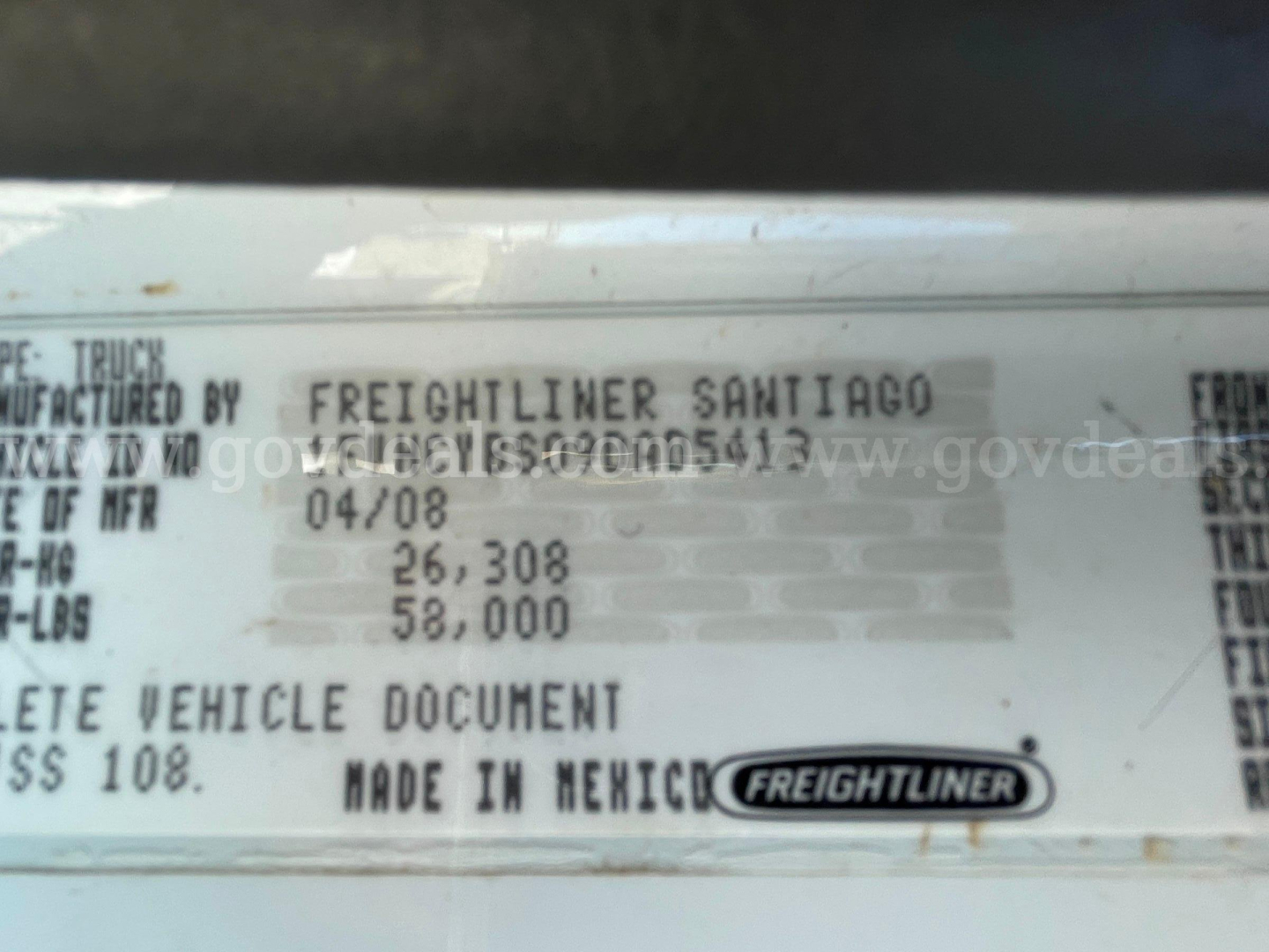 Label with VIN and manufacturing data on a Freightliner cab chassis. Text includes MADE IN MEXICO, FREIGHTLINER logo, and numbers such as 04/08.